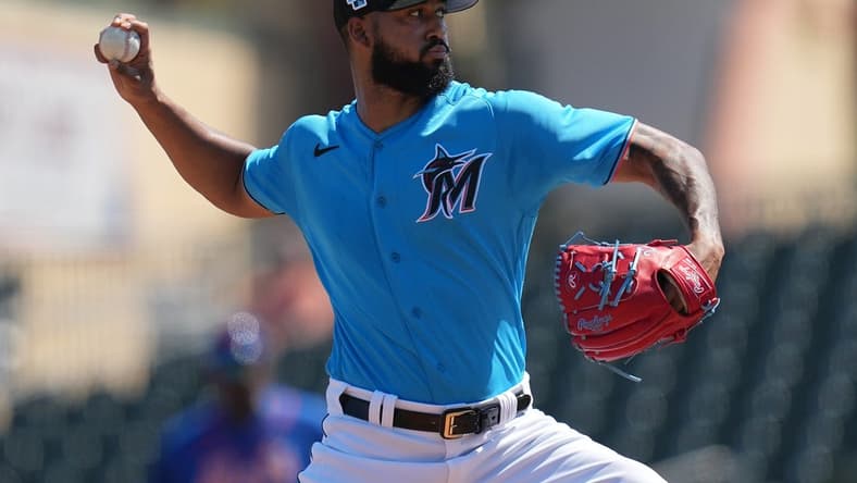 Mar 1, 2023; Jupiter, Florida, USA; Miami Marlins starting pitcher Sandy Alcantara (22) pitches against the New York Mets in the second inning at Roger Dean Stadium. Mandatory Credit: Jim Rassol-USA TODAY Sports