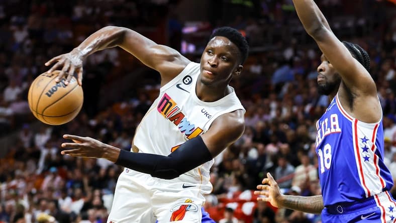 Mar 1, 2023; Miami, Florida, USA; Miami Heat guard Victor Oladipo (4) passes the basketball as Philadelphia 76ers guard Shake Milton (18) defends during the second quarter at Miami-Dade Arena. Mandatory Credit: Sam Navarro-USA TODAY Sports