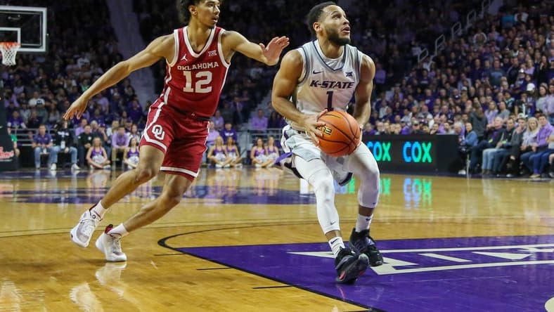 Mar 1, 2023; Manhattan, Kansas, USA; Kansas State Wildcats guard Markquis Nowell (1) drives to the basket against Oklahoma Sooners guard Milos Uzan (12) during the first half at Bramlage Coliseum. Mandatory Credit: Scott Sewell-USA TODAY Sports