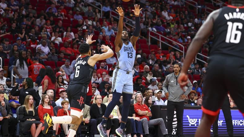 Mar 1, 2023; Houston, Texas, USA; Memphis Grizzlies forward Jaren Jackson Jr. (13) shoots the ball as Houston Rockets forward KJ Martin (6) defends during the second quarter at Toyota Center. Mandatory Credit: Troy Taormina-USA TODAY Sports