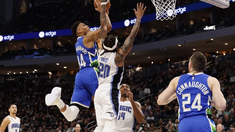 Mar 1, 2023; Milwaukee, Wisconsin, USA; Milwaukee Bucks forward Giannis Antetokounmpo (34) shoots against Orlando Magic guard Markelle Fultz (20) during the second quarter at Fiserv Forum. Mandatory Credit: Jeff Hanisch-USA TODAY Sports