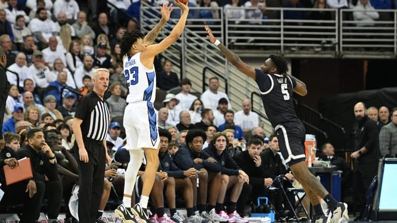 Mar 1, 2023; Omaha, Nebraska, USA; Creighton Bluejays guard Trey Alexander (23) shoots the ball against Georgetown Hoyas guard Jay Heath (5) in the first half at CHI Health Center Omaha. Mandatory Credit: Steven Branscombe-USA TODAY Sports