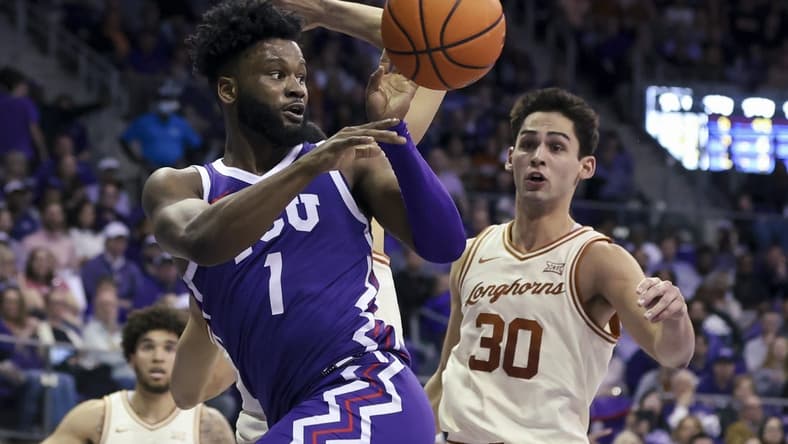 Mar 1, 2023; Fort Worth, Texas, USA;  TCU Horned Frogs guard Mike Miles Jr. (1) passes teh ball in front of Texas Longhorns forward Brock Cunningham (30) during the first half at Ed and Rae Schollmaier Arena. Mandatory Credit: Kevin Jairaj-USA TODAY Sports