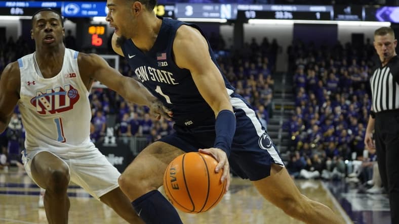 Mar 1, 2023; Evanston, Illinois, USA; Penn State Nittany Lions guard Seth Lundy (1) drives on Northwestern Wildcats guard Chase Audige (1) during the first half at Welsh-Ryan Arena. Mandatory Credit: David Banks-USA TODAY Sports
