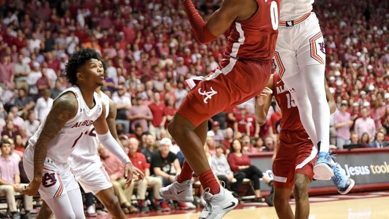 Mar 1, 2023; Tuscaloosa, AL, USA; Alabama guard Jaden Bradley (0) looks to pass as Auburn forward Jaylin Williams (2) leaps toward him at Coleman Coliseum. Alabama defeated Auburn 90-85 in overtime to claim the regular season SEC Championship.
Ncaa Basketball Auburn Tigers At Alabama Crimson Tide