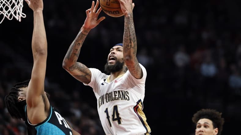 Mar 1, 2023; Portland, Oregon, USA; New Orleans Pelicans small forward Brandon Ingram (14) drives to the basket against Portland Trail Blazers power forward Brendon Watford (2) during the first half at Moda Center. Mandatory Credit: Soobum Im-USA TODAY Sports