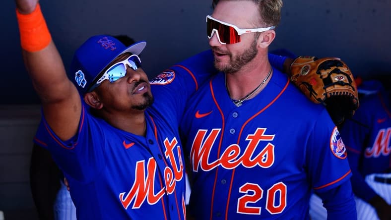 Mar 2, 2023; Port St. Lucie, Florida, USA; New York Mets third baseman Eduardo Escobar (10) and first baseman Pete Alonso (20) embrace prior to a game against the Atlanta Braves at Clover Park. Mandatory Credit: Rich Storry-USA TODAY Sports