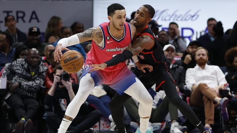 Mar 2, 2023; Washington, District of Columbia, USA; Washington Wizards forward Kyle Kuzma (33) drives to the basket as , toppic guard Will Barton (7) defends in the second quarter at Capital One Arena. Mandatory Credit: Geoff Burke-USA TODAY Sports
