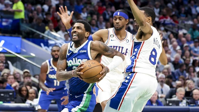 Mar 2, 2023; Dallas, Texas, USA;  Dallas Mavericks guard Kyrie Irving (2) drives to the basket past Philadelphia 76ers guard De'Anthony Melton (8) during the second quarter at American Airlines Center. Mandatory Credit: Kevin Jairaj-USA TODAY Sports
