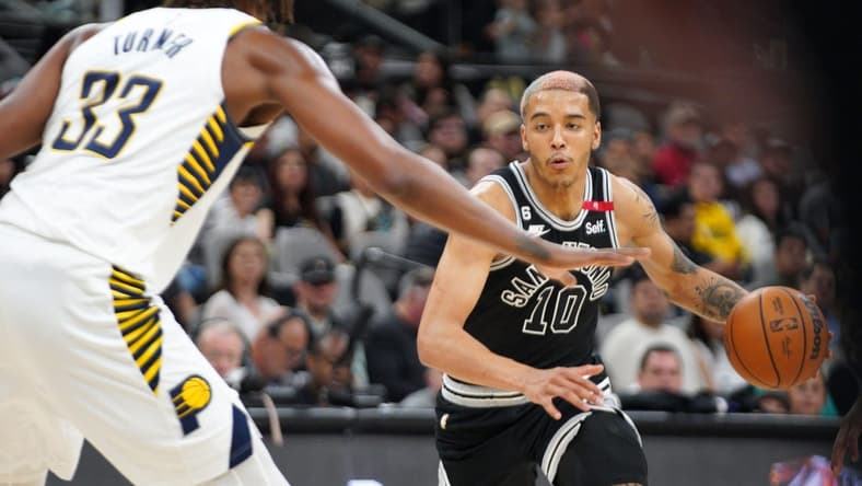 Mar 2, 2023; San Antonio, Texas, USA; San Antonio Spurs forward Jeremy Sochan (10) dribbles against Indiana Pacers center Myles Turner (33) in the second quarter at AT&T Center. Mandatory Credit: Dustin Safranek-USA TODAY Sports