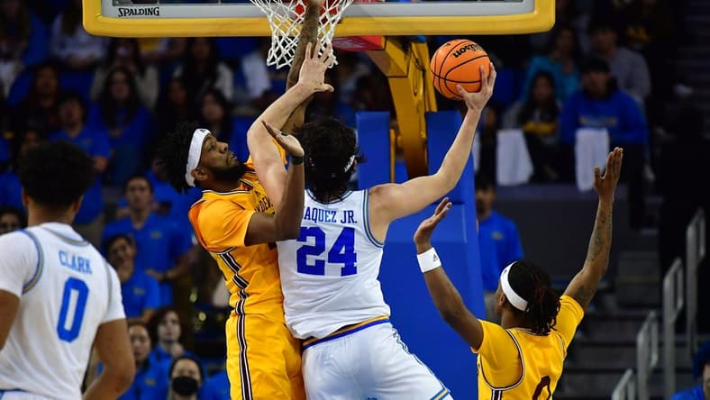 Mar 2, 2023; Los Angeles, California, USA; UCLA Bruins guard Jaime Jaquez Jr. (24) moves to the basket against Arizona State Sun Devils forward Warren Washington (22) and guard DJ Horne (0) during the first half at Pauley Pavilion. Mandatory Credit: Gary A. Vasquez-USA TODAY Sports