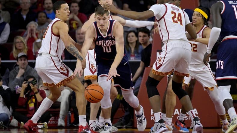 Mar 2, 2023; Los Angeles, California, USA; USC Trojans forward Kobe Johnson (0) and forward Joshua Morgan (24) defend a rebound by Arizona Wildcats forward Azuolas Tubelis (10) in the first half at Galen Center. Mandatory Credit: Jayne Kamin-Oncea-USA TODAY Sports