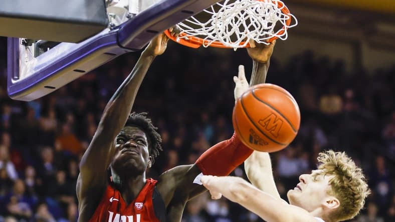 Mar 2, 2023; Seattle, Washington, USA; Washington State Cougars forward Mouhamed Gueye (35) dunks against Washington Huskies guard Cole Bajema (22) during the first half at Alaska Airlines Arena at Hec Edmundson Pavilion. Mandatory Credit: Joe Nicholson-USA TODAY Sports