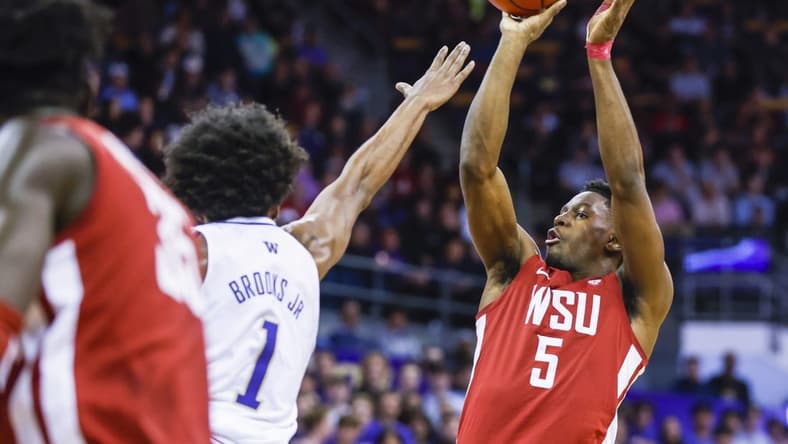 Mar 2, 2023; Seattle, Washington, USA; Washington State Cougars guard TJ Bamba (5) shoots against the Washington Huskies during the first half at Alaska Airlines Arena at Hec Edmundson Pavilion. Mandatory Credit: Joe Nicholson-USA TODAY Sports