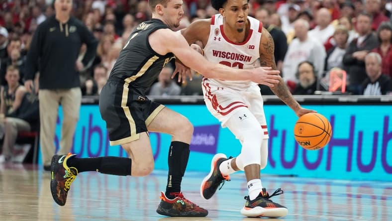 Mar 2, 2023; Madison, Wisconsin, USA; Purdue Boilermakers guard Braden Smith (3) fouls Wisconsin Badgers guard Chucky Hepburn (23) during the second half at the Kohl Center. Mandatory Credit: Kayla Wolf-USA TODAY Sports