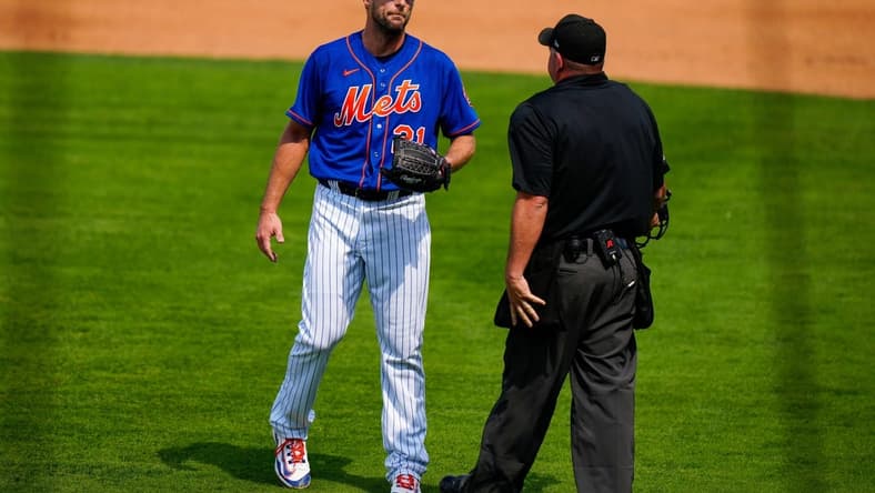 Mar 3, 2023; Port St. Lucie, Florida, USA; New York Mets starting pitcher Max Scherzer (21) speak to the umpire after being called for a balk on a quick pitch against the Washington Nationals during the second inning at Clover Park. Mandatory Credit: Rich Storry-USA TODAY Sports