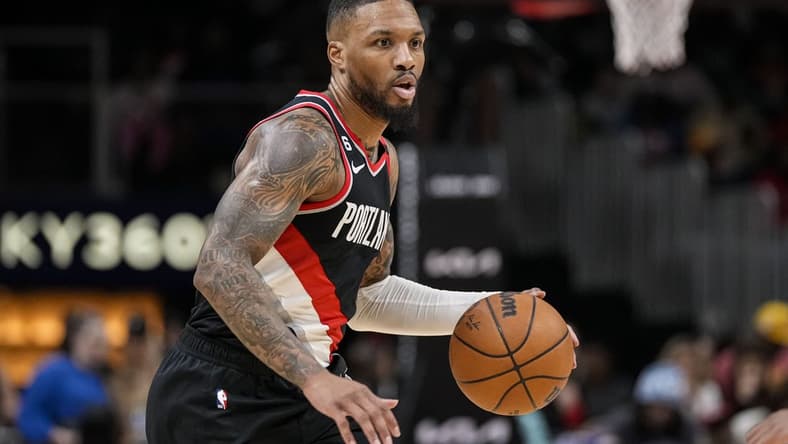 Mar 3, 2023; Atlanta, Georgia, USA; Portland Trail Blazers guard Damian Lillard (0) controls the ball against the Atlanta Hawks during the first half at State Farm Arena. Mandatory Credit: Dale Zanine-USA TODAY Sports