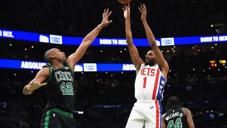 Mar 3, 2023; Boston, Massachusetts, USA;  Brooklyn Nets forward Mikal Bridges (1) shoots the ball against Boston Celtics center Al Horford (42) during the first half at TD Garden. Mandatory Credit: Bob DeChiara-USA TODAY Sports