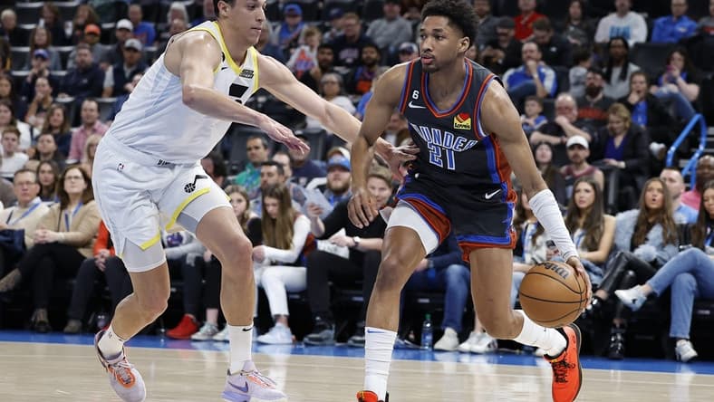 Mar 3, 2023; Oklahoma City, Oklahoma, USA; Oklahoma City Thunder guard Aaron Wiggins (21) drives to the basket against Utah Jazz forward Simone Fontecchio (16) during the second quarter at Paycom Center. Mandatory Credit: Alonzo Adams-USA TODAY Sports