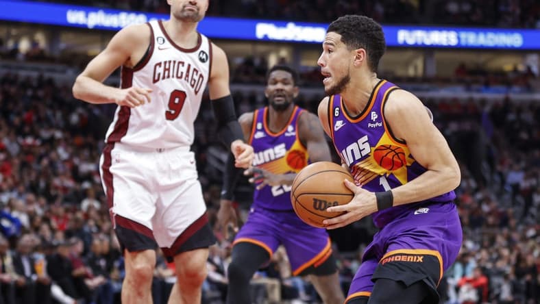 Mar 3, 2023; Chicago, Illinois, USA; Phoenix Suns guard Devin Booker (1) drives to the basket against the Chicago Bulls during the first half at United Center. Mandatory Credit: Kamil Krzaczynski-USA TODAY Sports