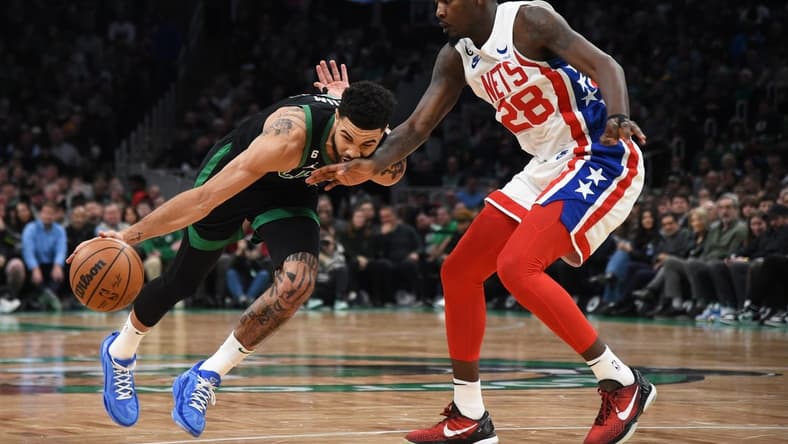 Mar 3, 2023; Boston, Massachusetts, USA; Brooklyn Nets forward Dorian Finney-Smith (28) defends Boston Celtics forward Jayson Tatum (0) during the first half at TD Garden. Mandatory Credit: Bob DeChiara-USA TODAY Sports