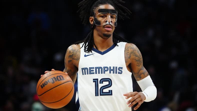 Mar 3, 2023; Denver, Colorado, USA; Memphis Grizzlies guard Ja Morant (12) dribbles during the first quarter against the Denver Nuggets at Ball Arena. Mandatory Credit: Ron Chenoy-USA TODAY Sports