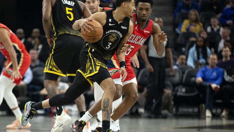 Mar 3, 2023; San Francisco, California, USA; Golden State Warriors guard Jordan Poole (3) drives around New Orleans Pelicans forward Herbert Jones (5) during the first quarter at Chase Center. Mandatory Credit: D. Ross Cameron-USA TODAY Sports