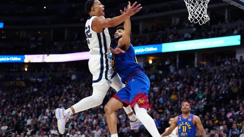Mar 3, 2023; Denver, Colorado, USA;Memphis Grizzlies guard Desmond Bane (22) drives to the basket against Denver Nuggets guard Jamal Murray (27) during the second quarter at Ball Arena. Mandatory Credit: Ron Chenoy-USA TODAY Sports