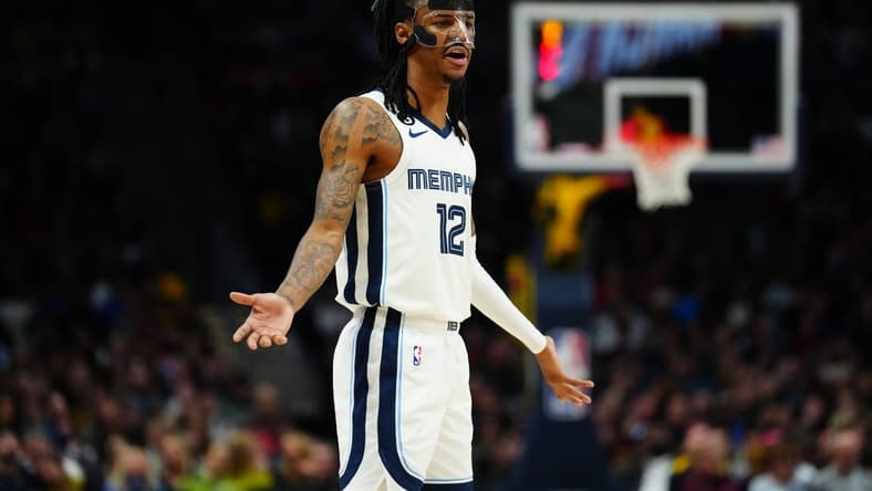 Mar 3, 2023; Denver, Colorado, USA; Memphis Grizzlies guard Ja Morant (12) reacts to a foul called in the second half against the Denver Nuggets at Ball Arena. Mandatory Credit: Ron Chenoy-USA TODAY Sports