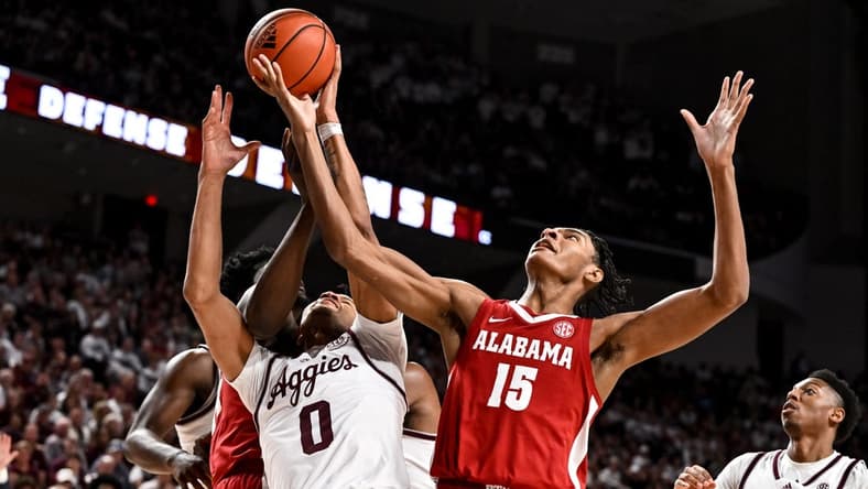 Mar 4, 2023; College Station, Texas, USA; Alabama Crimson Tide forward Noah Clowney (15) and Texas A&M Aggies guard Dexter Dennis (0) go for the rebound during the first half at Reed Arena. Mandatory Credit: Maria Lysaker-USA TODAY Sports