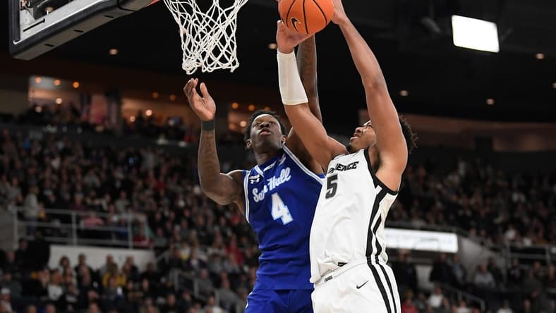 Mar 4, 2023; Providence, Rhode Island, USA; Seton Hall Pirates forward Tyrese Samuel (4) defends the basket from Providence Friars forward Ed Croswell (5) during the first half at Amica Mutual Pavilion. Mandatory Credit: Eric Canha-USA TODAY Sports