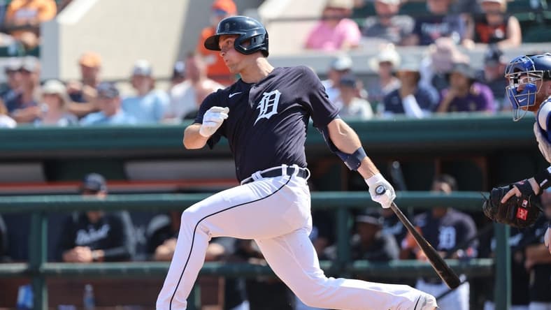 Mar 4, 2023; Lakeland, Florida, USA; Detroit Tigers infielder Andre Lipcius (27) hits a RBI single during the second inning against the Toronto Blue Jays at Publix Field at Joker Marchant Stadium. Mandatory Credit: Kim Klement-USA TODAY Sports
