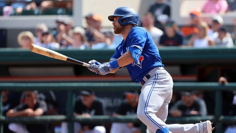 Mar 4, 2023; Lakeland, Florida, USA; Toronto Blue Jays infielder Vinny Capra (47) hits a sacrifice RBI during the second inning against the Detroit Tigers at Publix Field at Joker Marchant Stadium. Mandatory Credit: Kim Klement-USA TODAY Sports