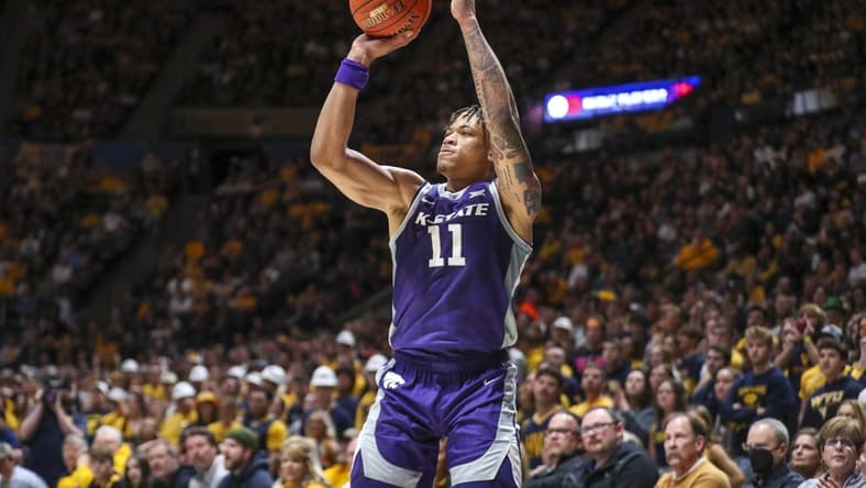 Mar 4, 2023; Morgantown, West Virginia, USA; Kansas State Wildcats forward Keyontae Johnson (11) shoots a three point basket during the first half against the West Virginia Mountaineers at WVU Coliseum. Mandatory Credit: Ben Queen-USA TODAY Sports