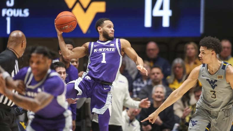 Mar 4, 2023; Morgantown, West Virginia, USA; Kansas State Wildcats guard Markquis Nowell (1) saves the ball from going out of bounds during the first half against the West Virginia Mountaineers at WVU Coliseum. Mandatory Credit: Ben Queen-USA TODAY Sports
