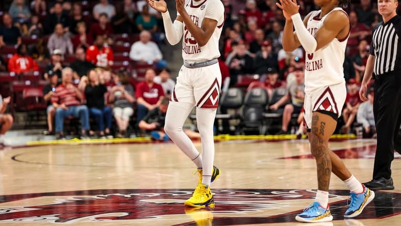 Mar 4, 2023; Columbia, South Carolina, USA; South Carolina Gamecocks forward Gregory "GG" Jackson II (23) and guard Meechie Johnson (5) celebrate a call being overturned in the second half against the Georgia Bulldogs at Colonial Life Arena. Mandatory Credit: Jeff Blake-USA TODAY Sports