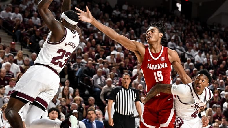 Mar 4, 2023; College Station, Texas, USA; Alabama Crimson Tide forward Noah Clowney (15) fights for a rebound against Texas A&M Aggies guard Tyrece Radford (23) and guard Wade Taylor IV (4) during the first half at Reed Arena. Mandatory Credit: Maria Lysaker-USA TODAY Sports