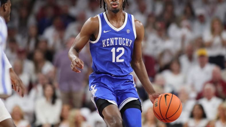 Mar 4, 2023; Fayetteville, Arkansas, USA; Kentucky Wildcats guard Antonio Reeves (12) dribbles during the first half against the Arkansas Razorbacks at Bud Walton Arena. Kentucky won 88-79. Mandatory Credit: Nelson Chenault-USA TODAY Sports