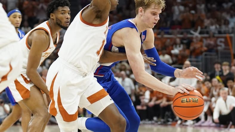 Feb 21, 2023; Austin, Texas, USA; Kansas Jayhawks guard Gradey Dick (4) drives to the basket against Texas Longhorns guard Sir'Jabari Rice (10) during the second half at Moody Center. Mandatory Credit: Scott Wachter-USA TODAY Sports
