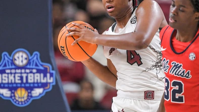 Mar 4, 2023; Greenville, SC, USA; South Carolina forward Aliyah Boston (4) rebounds the ball against Mississippi forward Madison Scott (24) during the fourth quarter at Bon Secours Wellness Arena. Mandatory Credit: Ken Ruinard-USA TODAY Sports