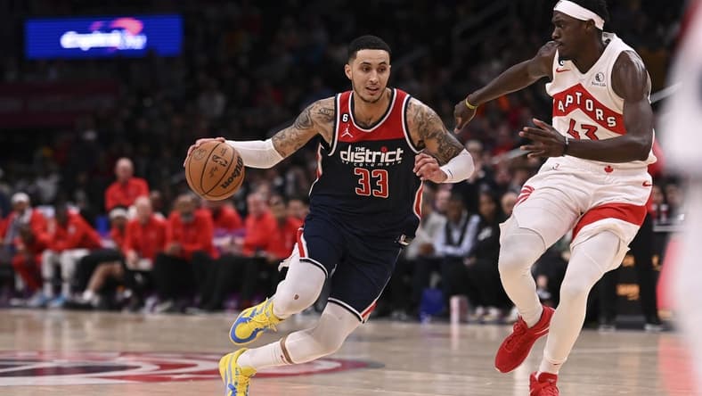 Mar 4, 2023; Washington, District of Columbia, USA; Washington Wizards forward Kyle Kuzma (33) makes a move to the basket as Toronto Raptors forward Pascal Siakam (43) defends during the during over time at Capital One Arena. Mandatory Credit: Tommy Gilligan-USA TODAY Sports