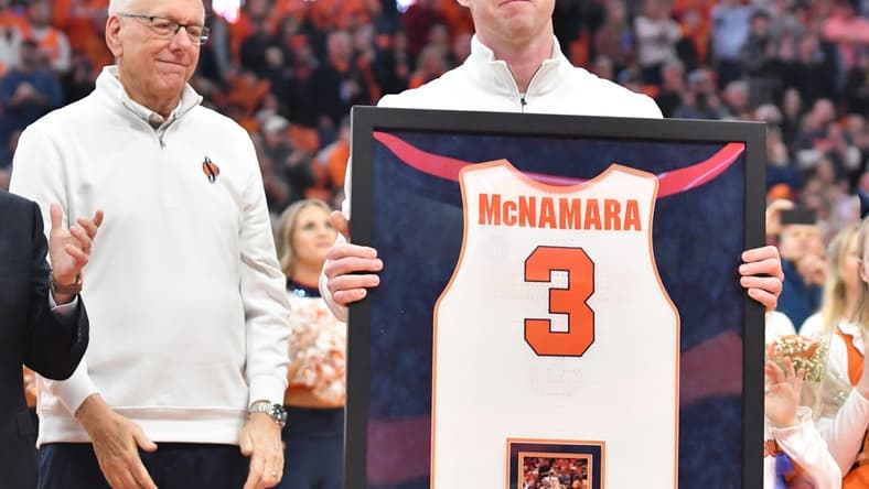 Mar 4, 2023; Syracuse, New York, USA; Syracuse Orange former player Gerry McNamara holds his framed jersey during a ceremony to retire his number at JMA Wireless Dome. Mandatory Credit: Mark Konezny-USA TODAY Sports