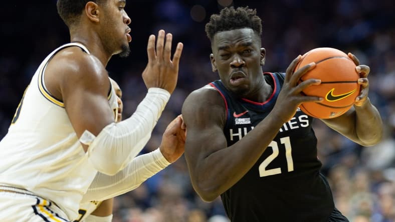 Mar 4, 2023; Philadelphia, Pennsylvania, USA; Connecticut Huskies forward Adama Sanogo (21) drives against Villanova Wildcats forward Eric Dixon (43) during the first half at Wells Fargo Center. Mandatory Credit: Bill Streicher-USA TODAY Sports