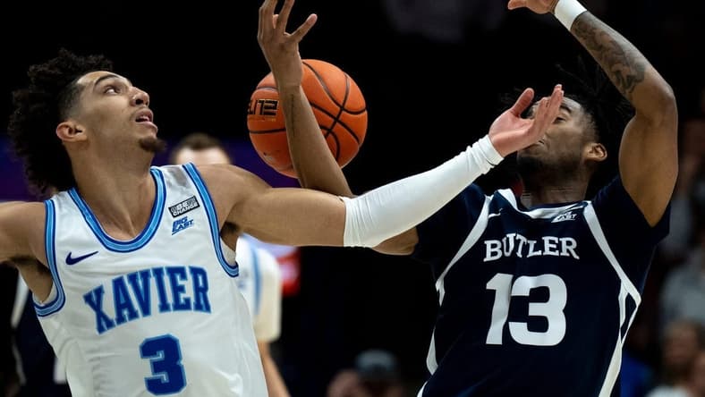Xavier Musketeers guard Colby Jones (3) and Butler Bulldogs guard Jayden Taylor (13) competes for a ball in the first half of the NCAA men   s basketball game between the Xavier Musketeers and the Butler Bulldogs at the Cintas Center in Cincinnati on Saturday, March 4, 2023.

Ncaa Basketball Butler Bulldogs At Xavier Musketeers