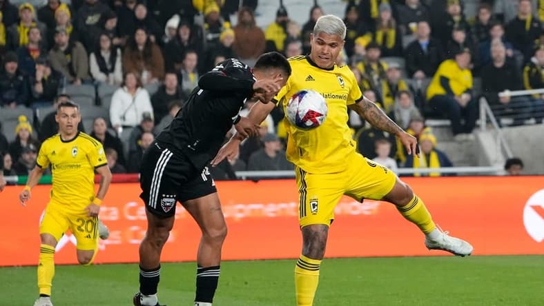 Mar 4, 2023; Columbus, Ohio, USA; Columbus Crew forward Cucho Hernandez (9) fights for a ball with D.C. United midfielder Andy Najar (14) during the first half of the MLS soccer match at Lower.com Field. Mandatory Credit: Adam Cairns-The Columbus Dispatch
Mls Ceb Crew Dc