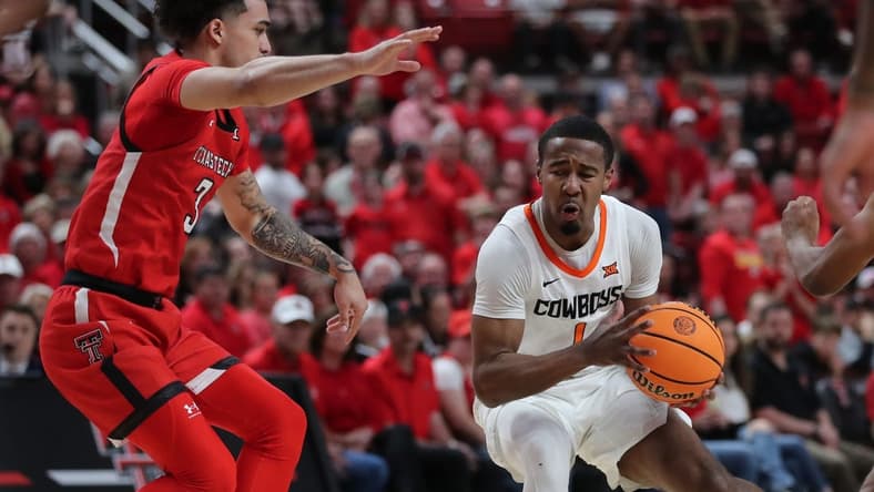Mar 4, 2023; Lubbock, Texas, USA;  Oklahoma State Cowboys guard Bryce Thompson (1) works the ball against Texas Tech Red Raiders guard D   Maurian Williams (3) in the second half at United Supermarkets Arena. Mandatory Credit: Michael C. Johnson-USA TODAY Sports