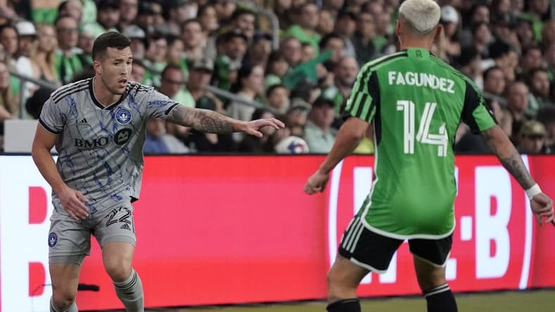 Mar 4, 2023; Austin, Texas, USA; CF Montreal defender Aaron Herrera (22) plays the ball against Austin FC forward Diego Fagundez (14) at Q2 Stadium. Mandatory Credit: Scott Wachter-USA TODAY Sports