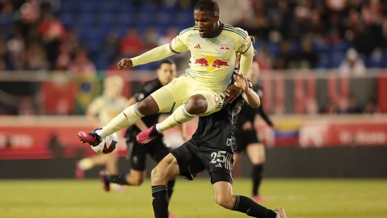 Mar 4, 2023; Harrison, New Jersey, USA; New York Red Bulls forward Elias Manoel (11) and Nashville SC defender Walker Zimmerman (25) battle for the ball during the second half at Red Bull Arena. Mandatory Credit: Vincent Carchietta-USA TODAY Sports