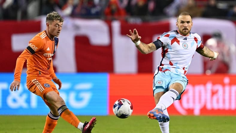 Mar 4, 2023; Chicago, Illinois, USA;  Chicago Fire FC defender Rafael Czichos (5) kicks the ball past New York City FC midfielder Matias Pellegrini (17) in the first half at Soldier Field. Mandatory Credit: Jamie Sabau-USA TODAY Sports