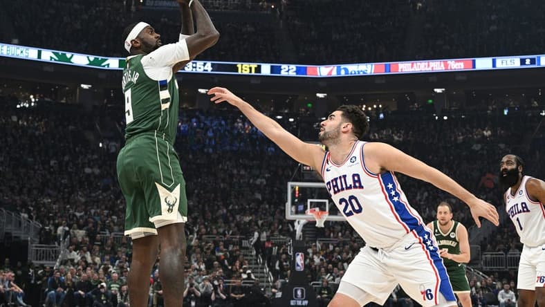 Mar 4, 2023; Milwaukee, Wisconsin, USA; Milwaukee Bucks forward Bobby Portis (9) shoots the ball against Philadelphia 76ers forward Georges Niang (20) in the first half at Fiserv Forum. Mandatory Credit: Michael McLoone-USA TODAY Sports